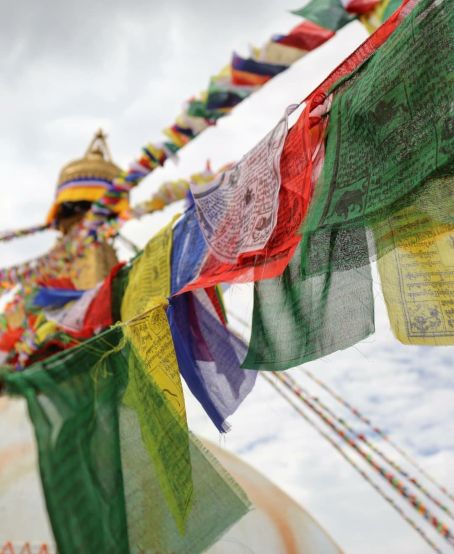 Spin the prayer wheels at the Stupa
